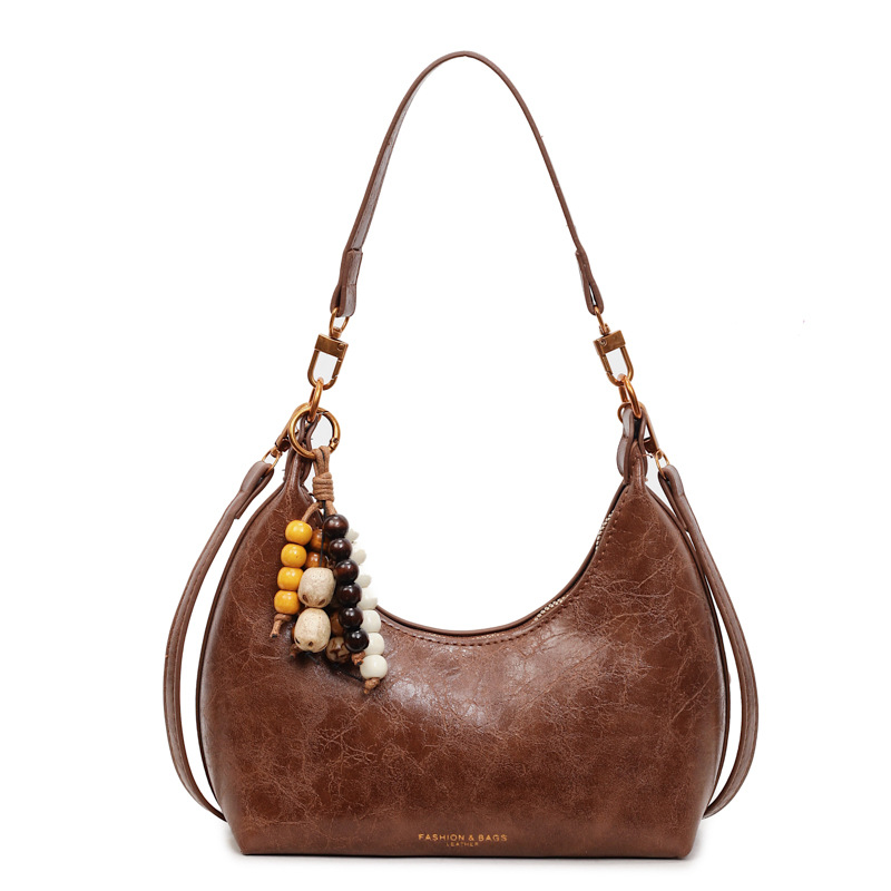 Bolsa de cuero suave retro, bolso de brazo de mujer de estilo extranjero, bolso de hombro de un solo hombro, 2025 nuevo bolso de mano.