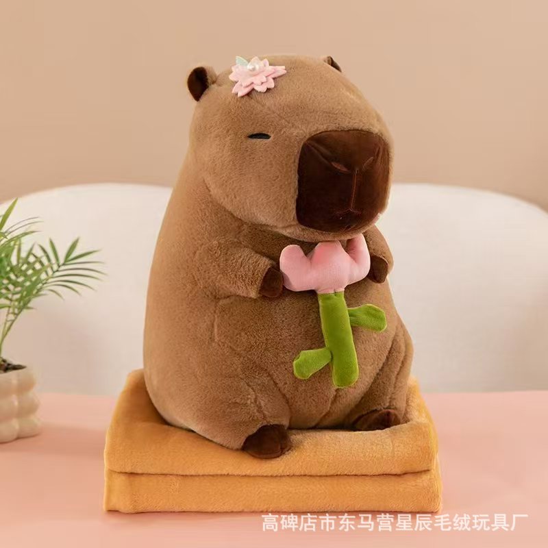 꽃을 안고 있는 카피바라