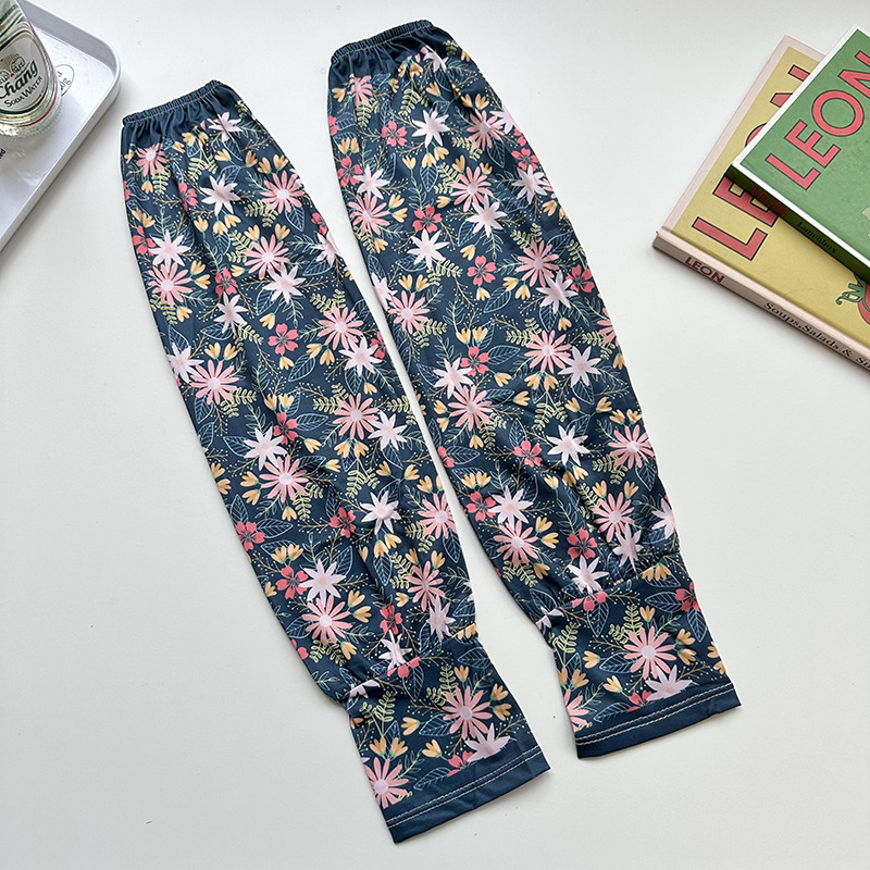 Mangas de protección solar para mujeres de verano nuevo estilo al aire libre anti-UV patrón de montar mangas de brazo de impresión de viento elegante