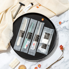 Disposable toothbrushes with toothpaste, soft-bristled hotel & guesthouse essentials—plus custom-designed comb sets available for wholesale.