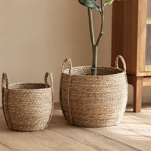 Wholesale pastoral seaweed woven handmade flower basket with handle rattan decorative flower pot large clothes storage basket