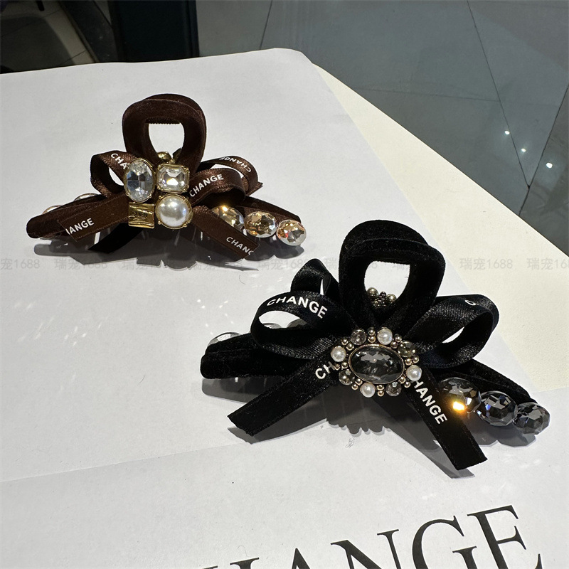 蝴蝶結抓夾網紅款女水鑽珍珠盤髮夾2023新款後腦勺鯊魚夾發卡頭飾