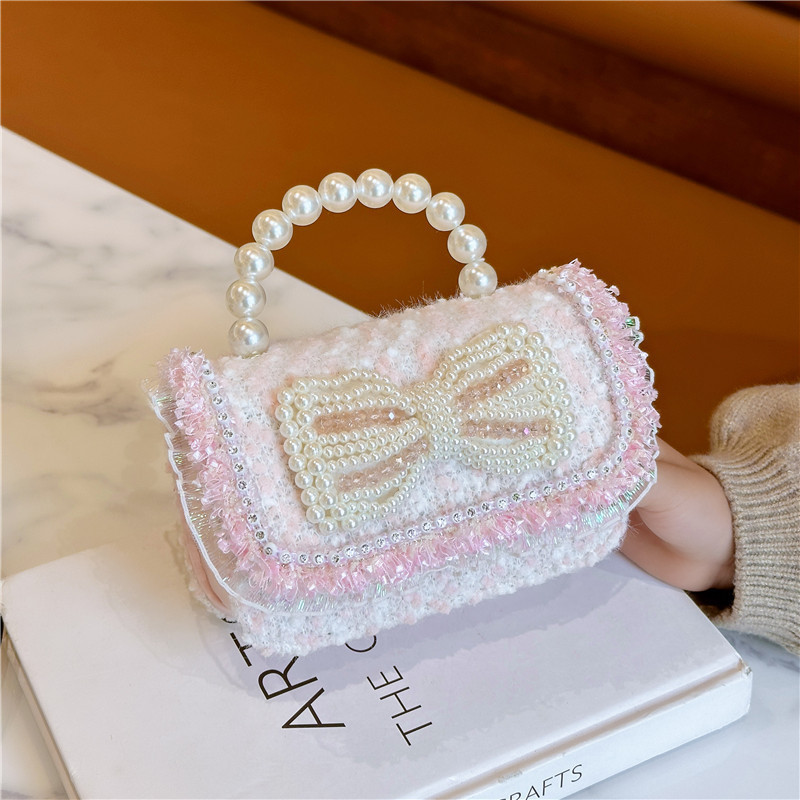 2025 primavera nuevo estilo lentejuelas lazo de perlas niña princesa mano mano accesorios diagonales bolso monedero