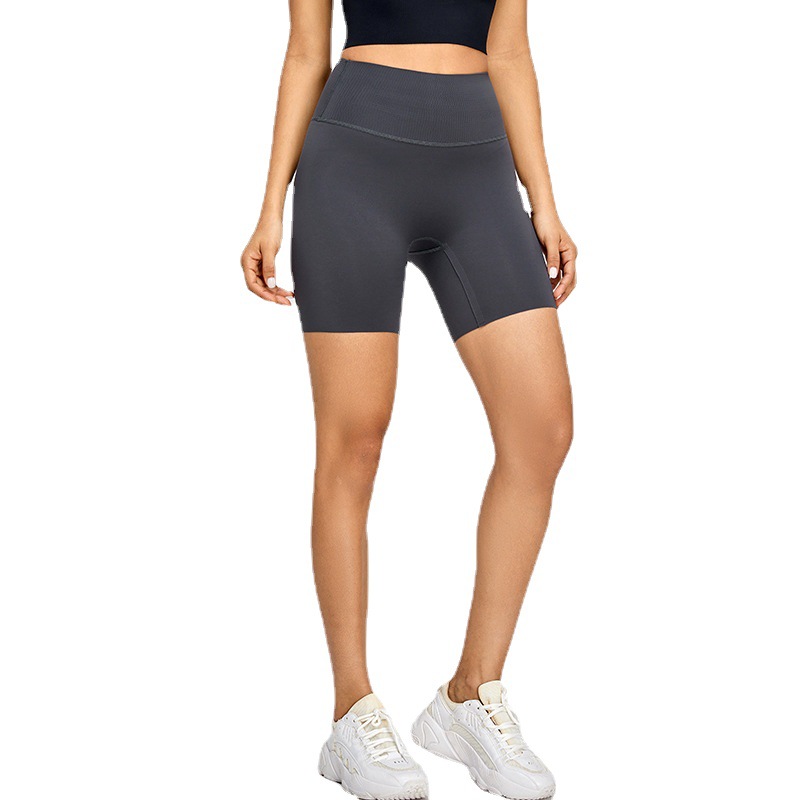 Nude Lycra apretados pantalones cortos de fitness ropa de yoga desnuda de mujer Cintura alta Peach Hip lifting pantalones cortos de yoga deportivos de secado rápido