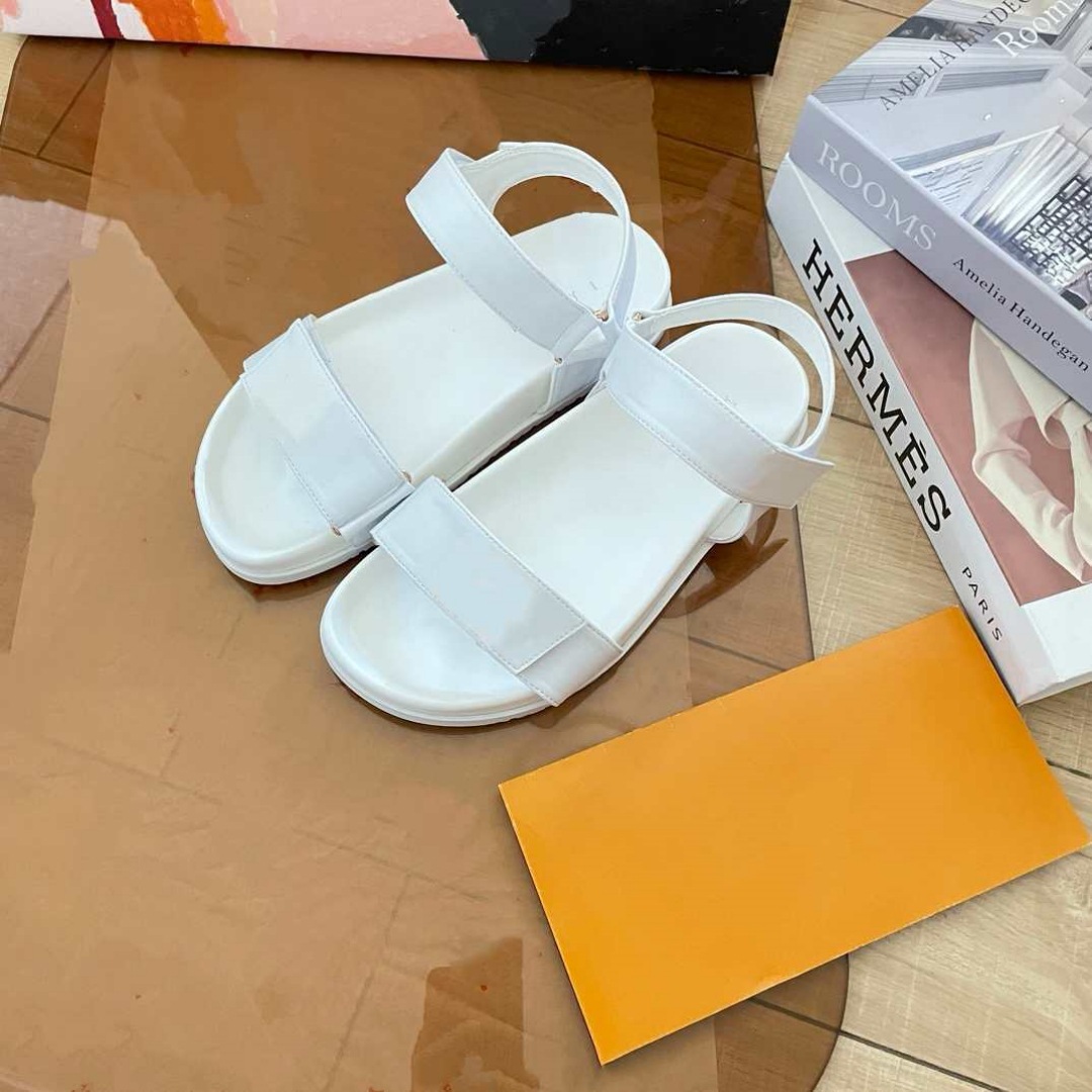 Donkey Home estación europea diseñador de alta versión 2025 nuevas sandalias de playa de cuero zapatillas de hebilla metálica plana