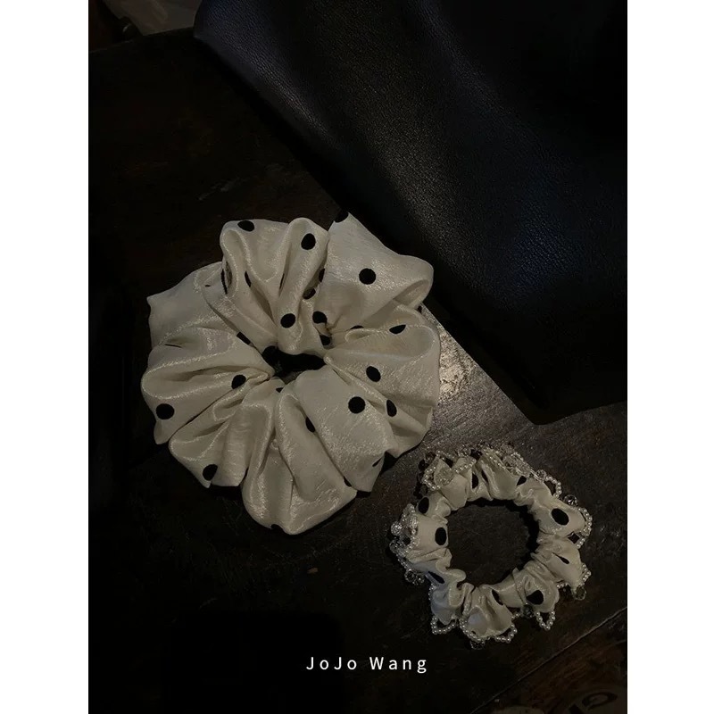 The texture is amazing! The pearlescent dots give it a classy look. This scrunchie is a stylish Korean fashion hair accessory for women