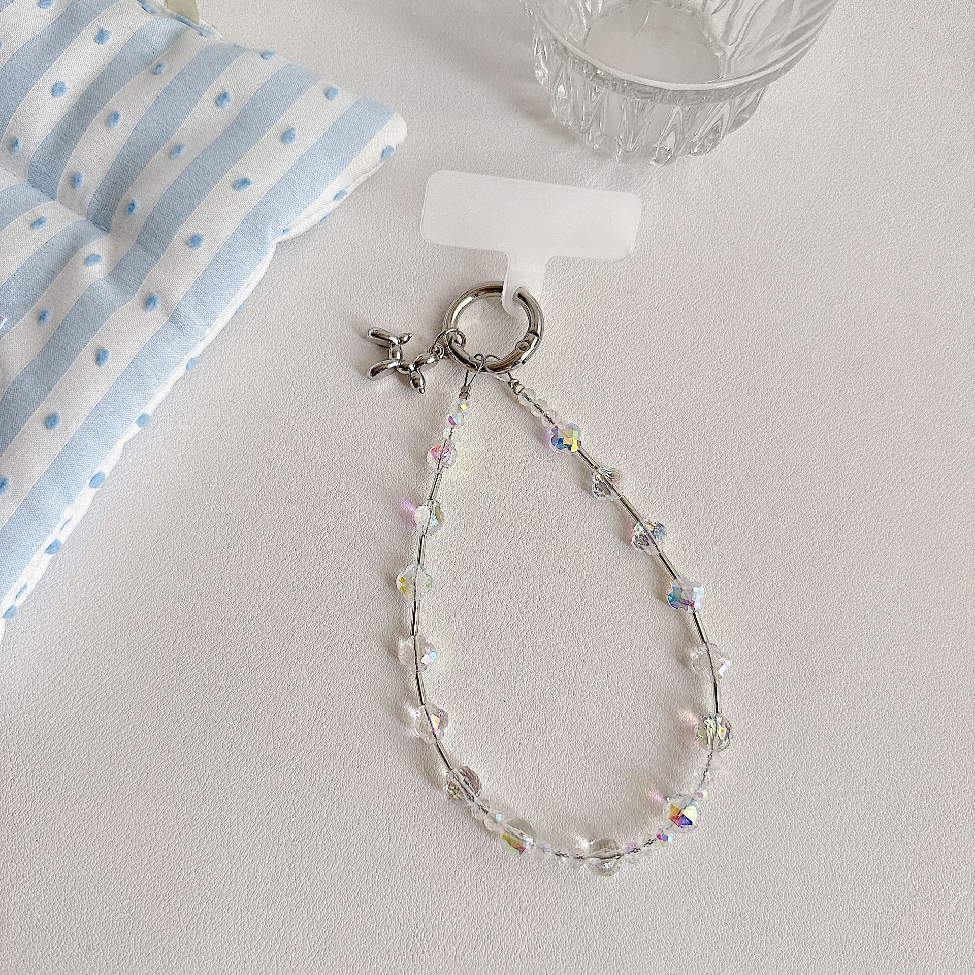 Boutique hecho a mano de alta gama para teléfono móvil cadena de muñeca de trébol de cuatro hojas de cristal original cadena de teléfono móvil de moda cuerda corta