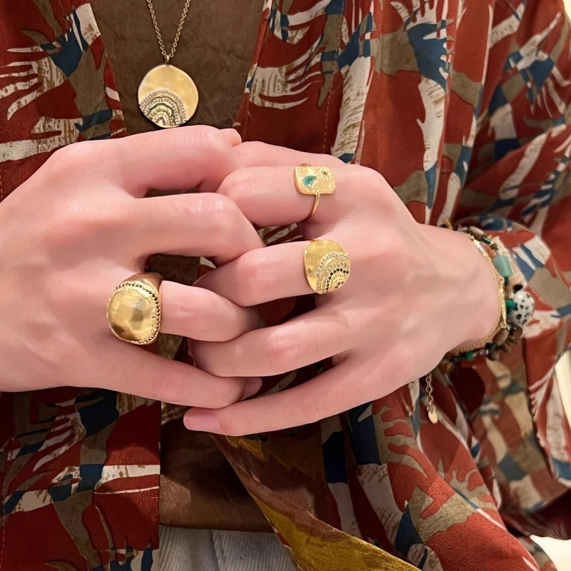 Golden geometric stone inlay with zircon
