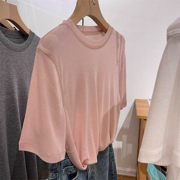 White base knitted summer T-shirt with a round collar