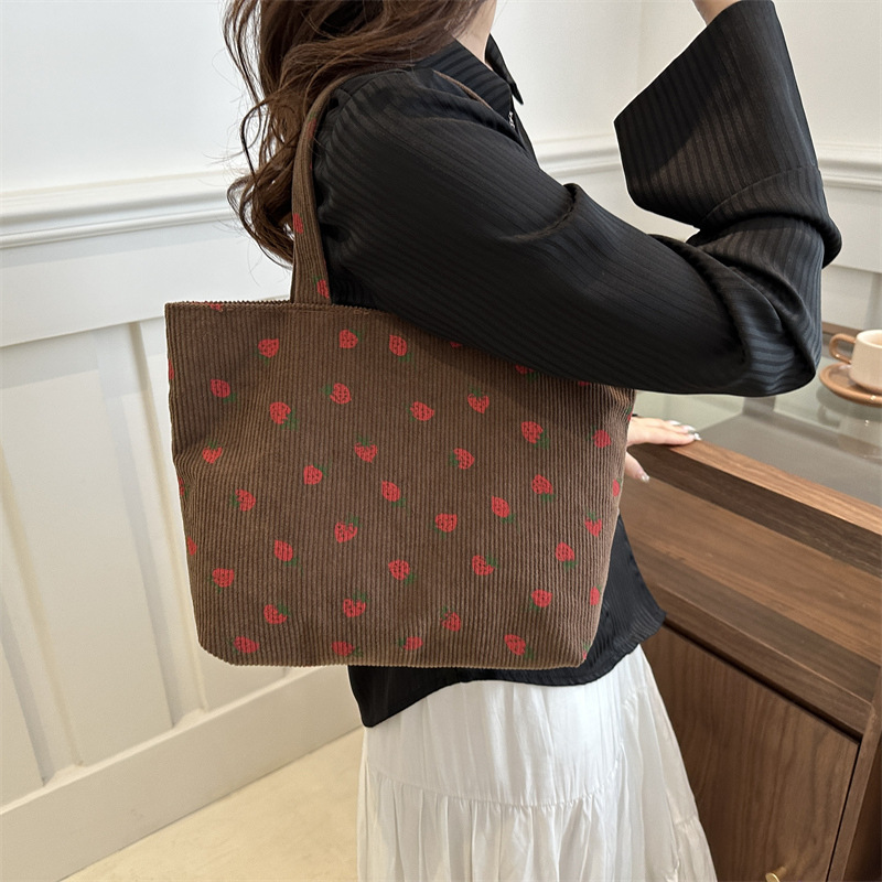 2026 nuevo bolso de transporte de gran capacidad impresión de fresas bolso de hombro de estudiantes