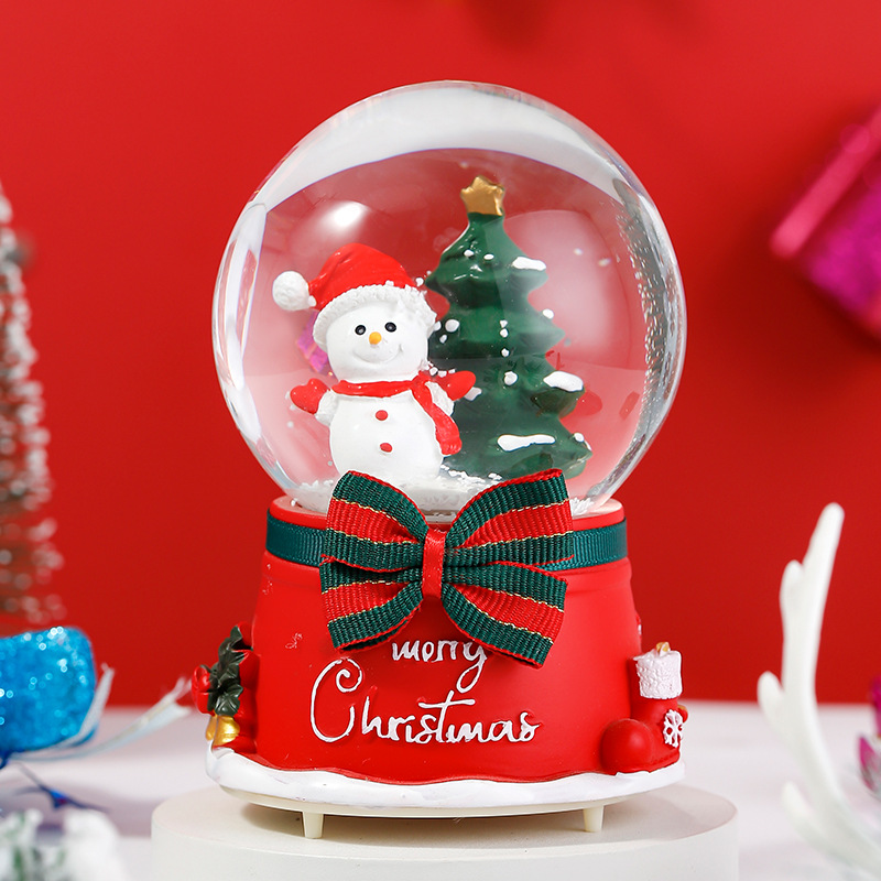 Una variedad de regalos de decoración de Navidad Navidad iluminante bola de cristal caja de música ventana diseño de velas lámparas de viento árbol de Navidad