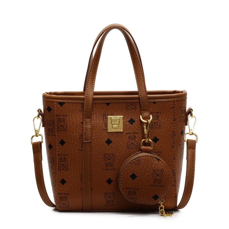 Bolsa de cubo portátil de impresión de moda super caliente para mujeres 2025, nuevo bolso de hombro de nicho universal, bolso de cinturón en línea.