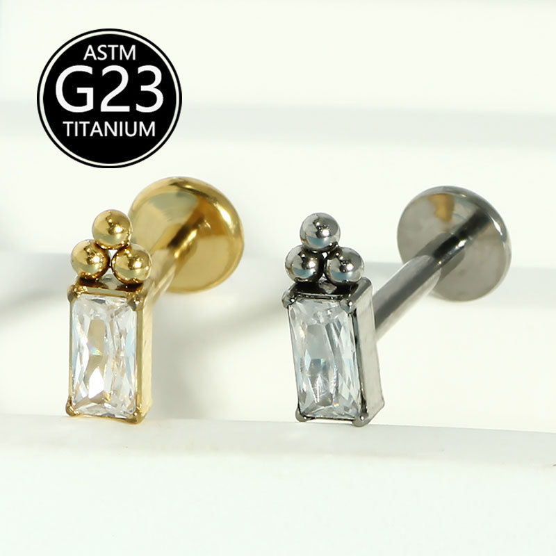 Silver pointed spike labret stud material detail