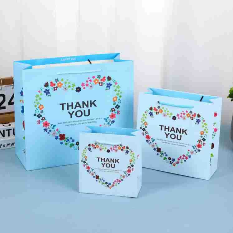 Bolsa de regalo Lindo bolso de cartón blanco impreso LOGO embalaje bolso de dibujos animados regalo de mano al por mayor bolsa de regalo de boda