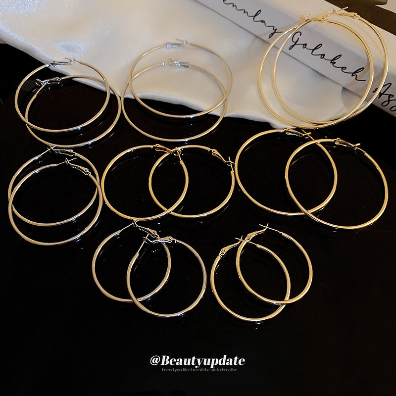 Aguja de plata minimalista redondo liso pendientes nicho estilo frío pendientes elegantes de Cercanías de alta calidad pendientes de moda al por mayor