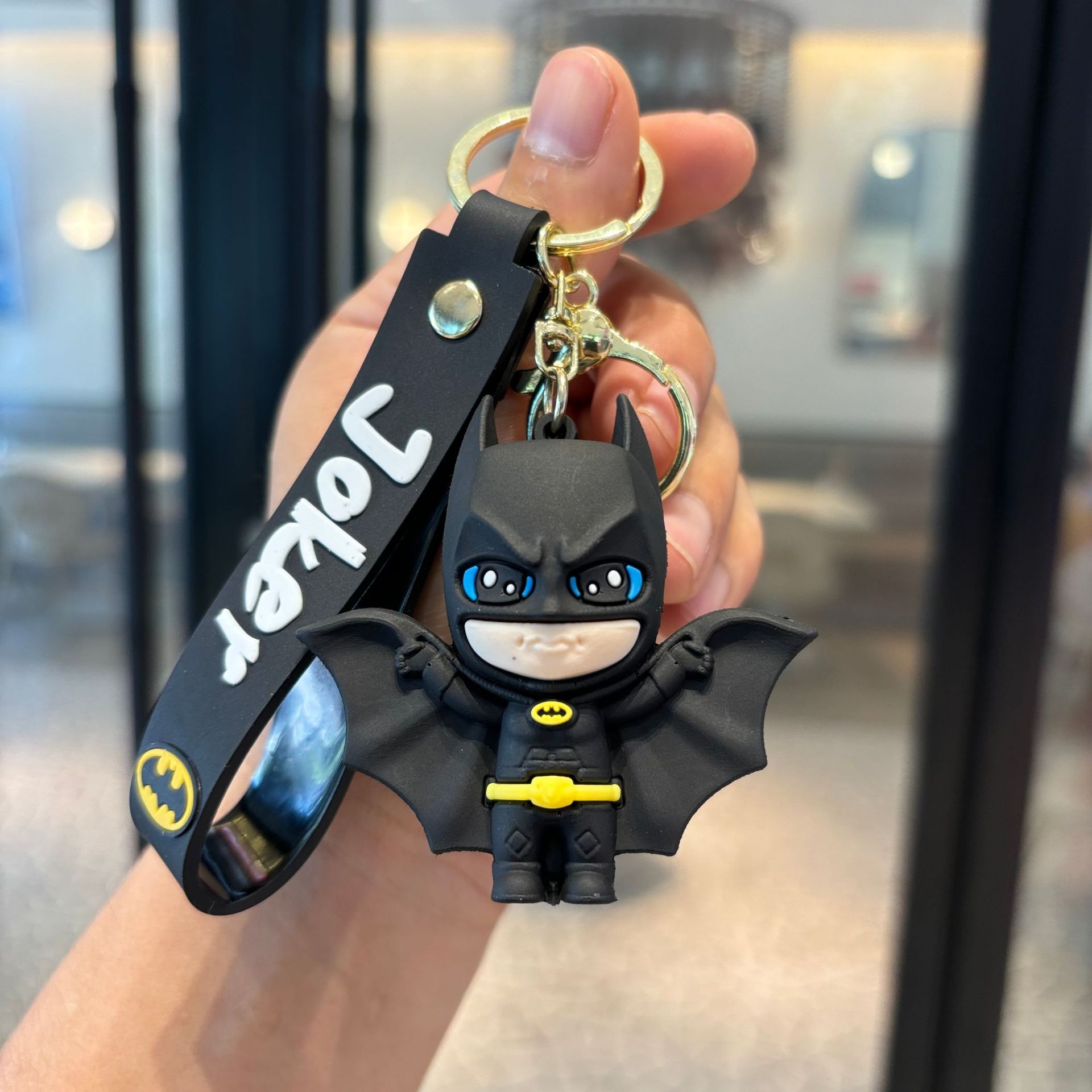 Batman cruzado superhéroes clown muñeca coche llavero colgante muñeca máquina de regalo pequeño