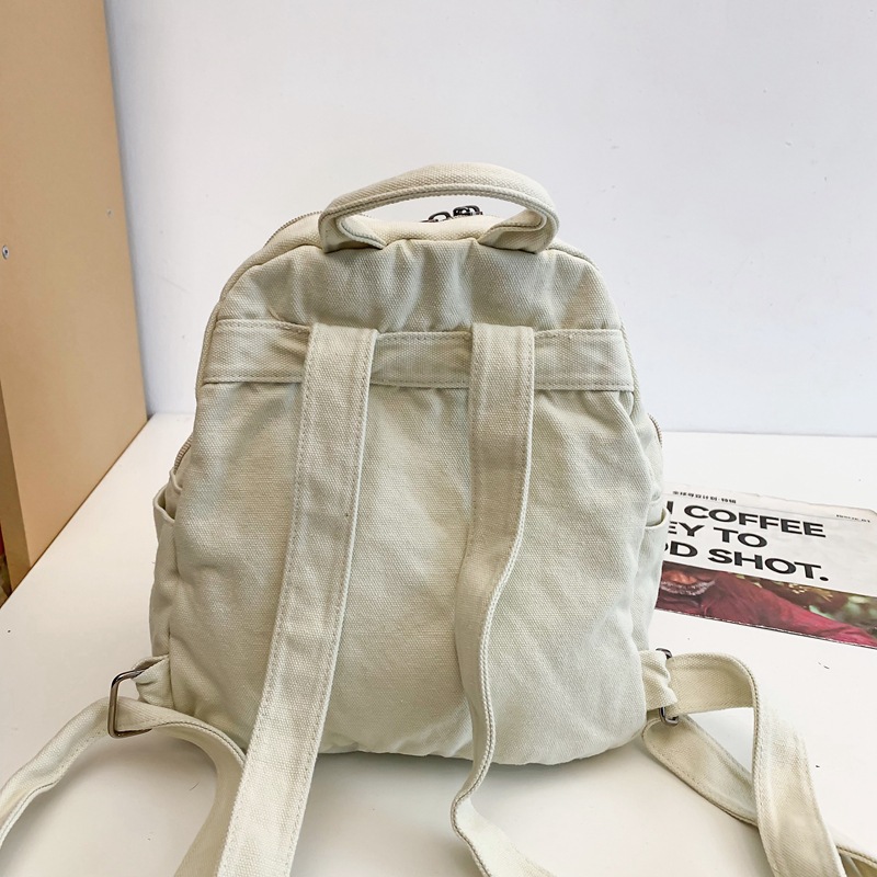 Mochila de lona para mujer 2024 nueva moda al aire libre viaje pequeño mochila casual todo fósforo clase mochila escolar marea