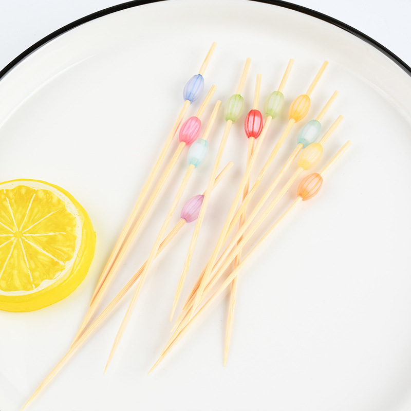 Mayorista en línea coloridas perlas de fruta stick artístico desechable bambú colorido perlas de pastel stick stick sushi