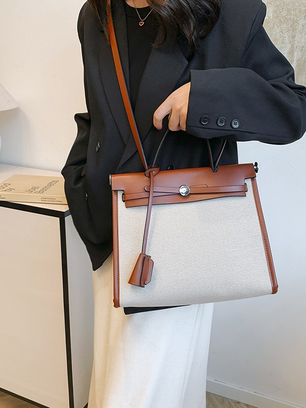 Bolso Carey Tote portátil de alta gama 2025 Nuevo estilo transfronterizo Bolso bandolera de gran capacidad de contraste de lona