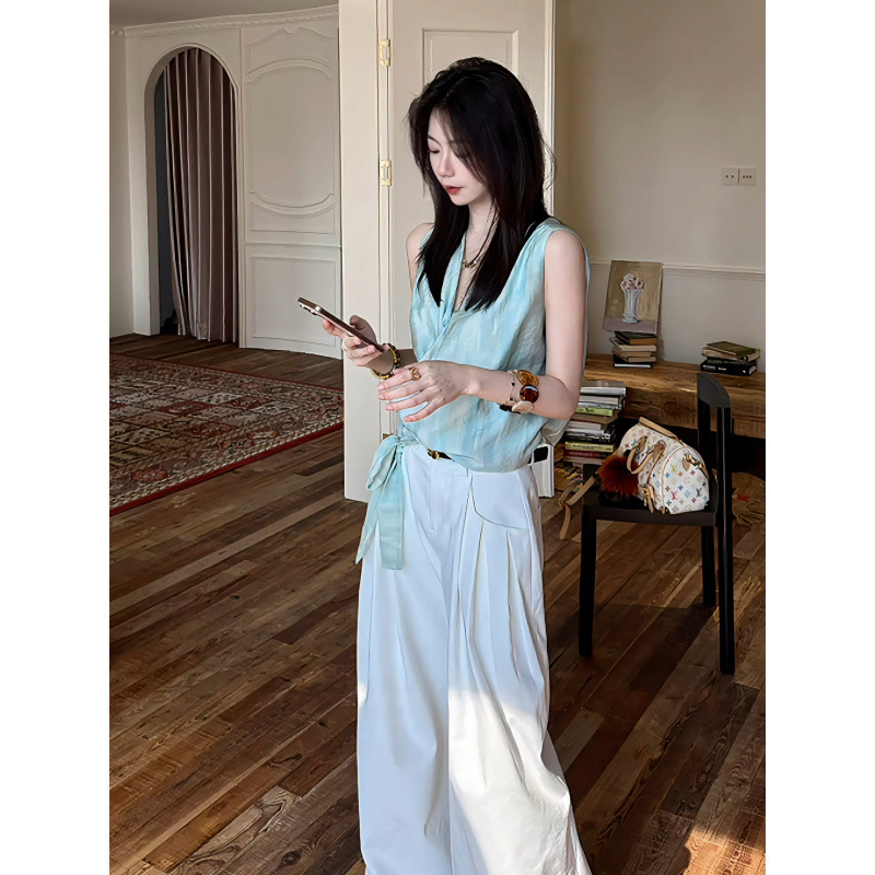 Mint-colored shimmering cross-wrap tie top, unique design with a sense of ambiance and flowing ribbons Mint-colored shimmering cross-wrap tie top, unique design with a sense of ambiance and flowing ribbons