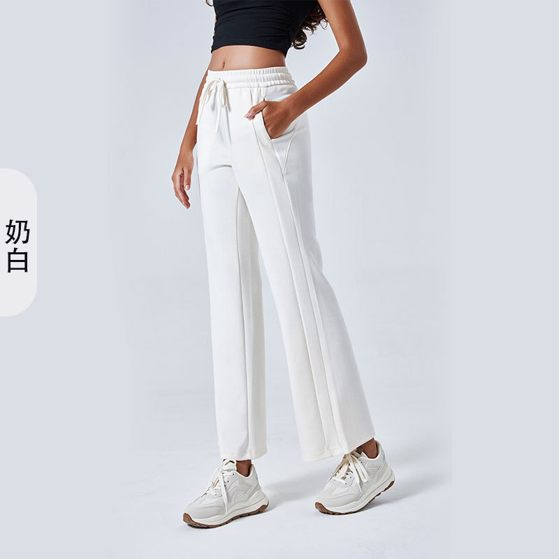 Otoño y invierno nuevo aire de algodón suelto pantalones deportivos simples de mujer cuerda delgada pantalones de yoga de doble bolsillo