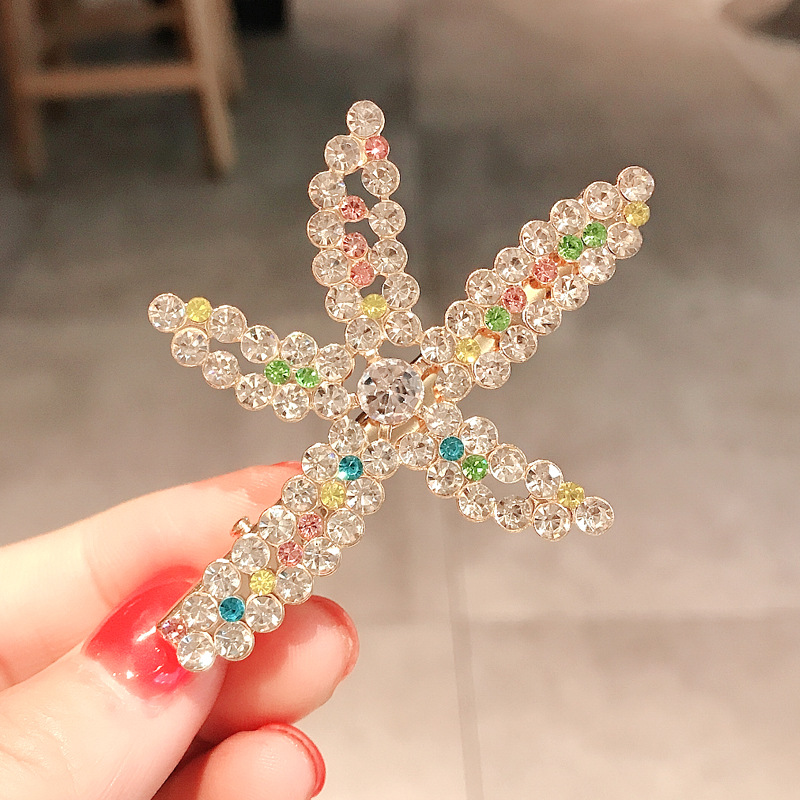 073 Боковой зажим в виде морской звезды со стразами