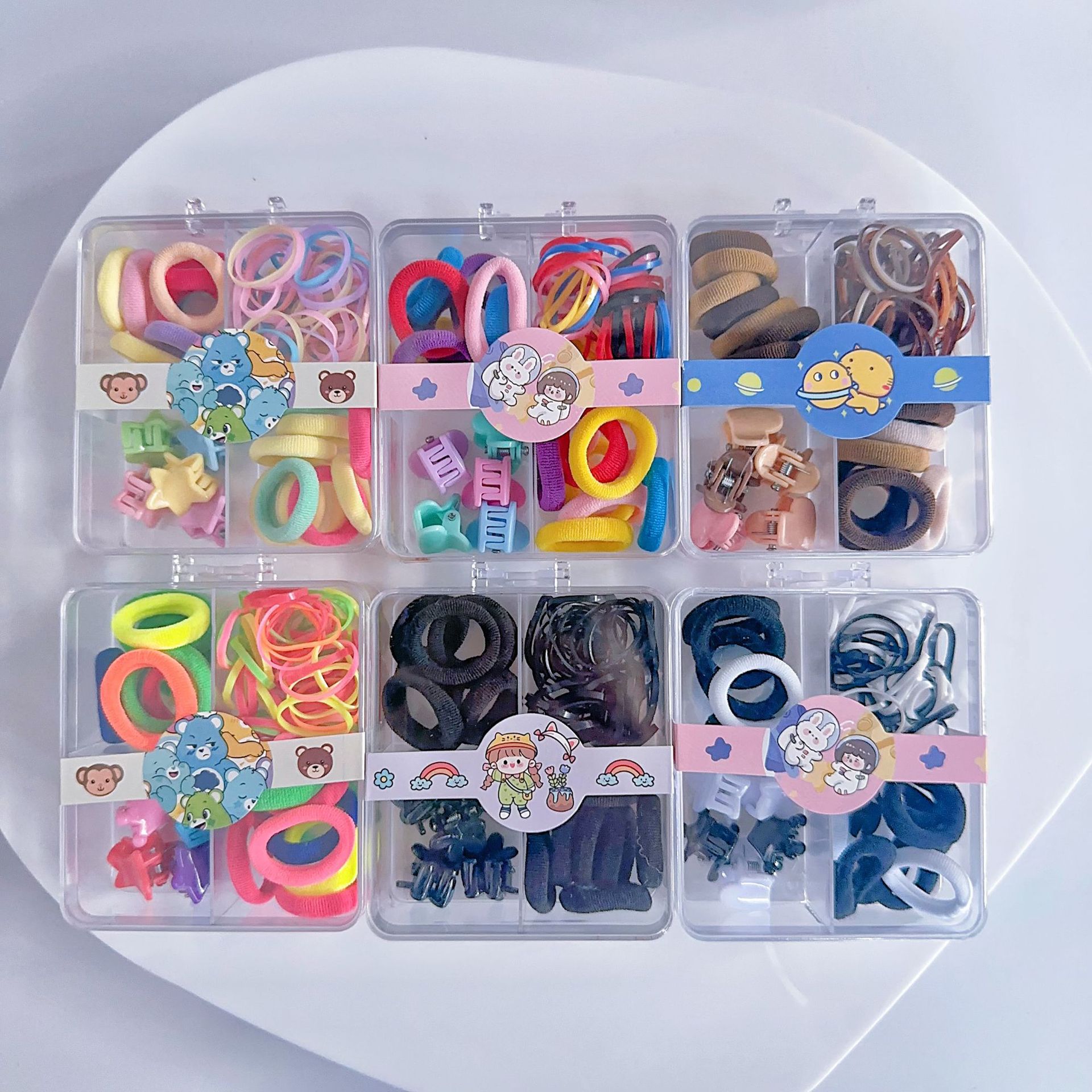 Al por mayor 2.5 pulgadas pulgar pequeño anillo de cabello nuevo niño no lesiones de cabello correa de color caja de chaqueta de cabello pequeña personalidad encantadora