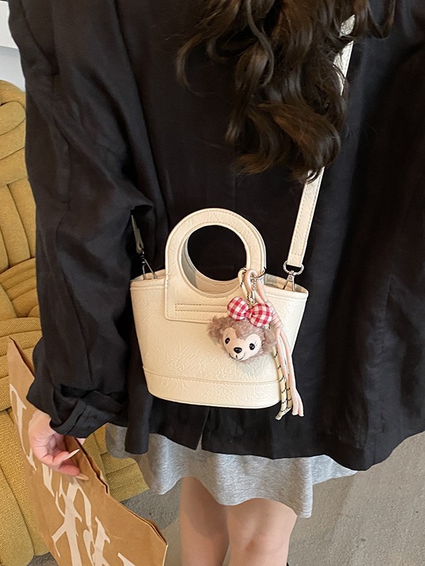 Bolso para mujeres 2026 nuevo nicho coreano de comida de mano cesta bolsa de cubo de textura alta de viaje mochila de hombro