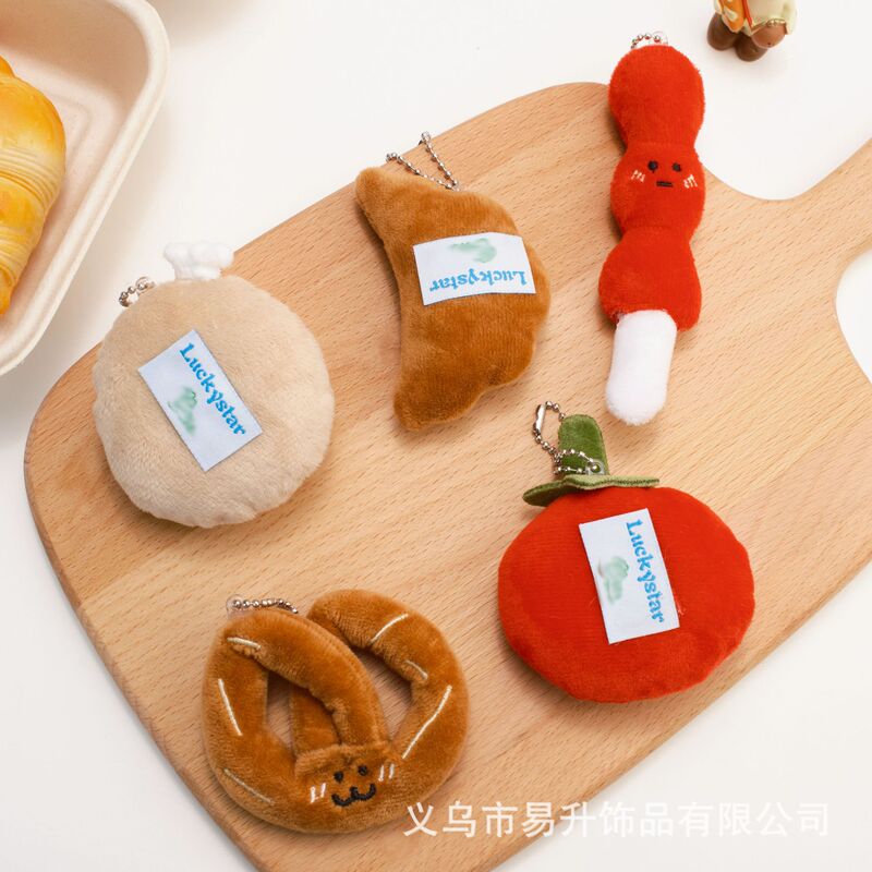 創意的な漫画の食品のぬいぐるみのペンダントの趣味は牛の角のカバンの子供の鍵を遊んでリュックサックを掛けて飾って屋台を並べて卸売りします。|undefined