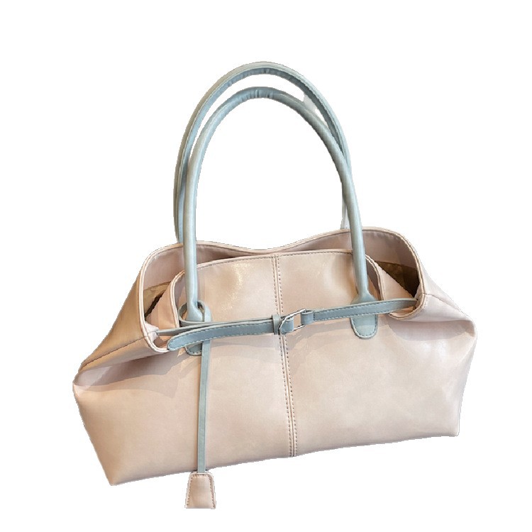 Bolsos de tendencia diaria coreana 2026 primavera nueva moda simple gran capacidad bolso de hombro bolso especial