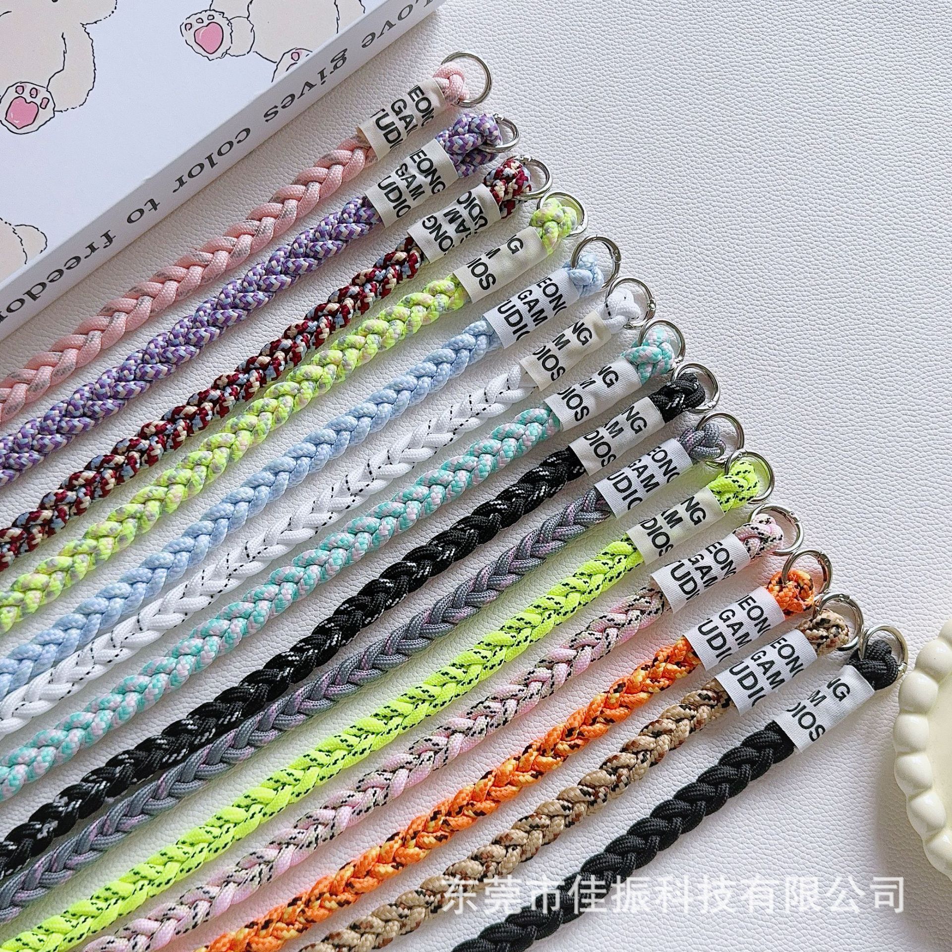 Mobile phone, long woven strap, suspenders, bag, protective pack