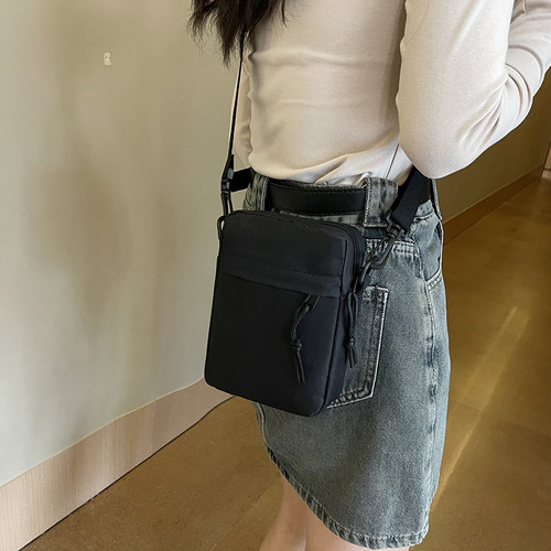 Oxford cloth casual crossbody bag for boys new Japanese style ins simple solid color versatile mobile phone bag women's street backpack