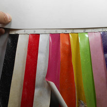 镜面珠光光胶PVC撒粉 金葱点淋膜漆皮亮面PU人造革鞋包手袋革面料