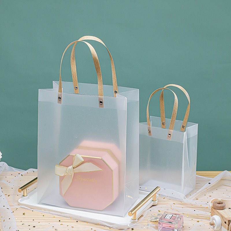 Bolsas de plástico PP de alta calidad bolsas de regalo de PVC esmeriladas bolsas de embalaje transparentes al por mayor bolsas de regalo de mano de gran capacidad