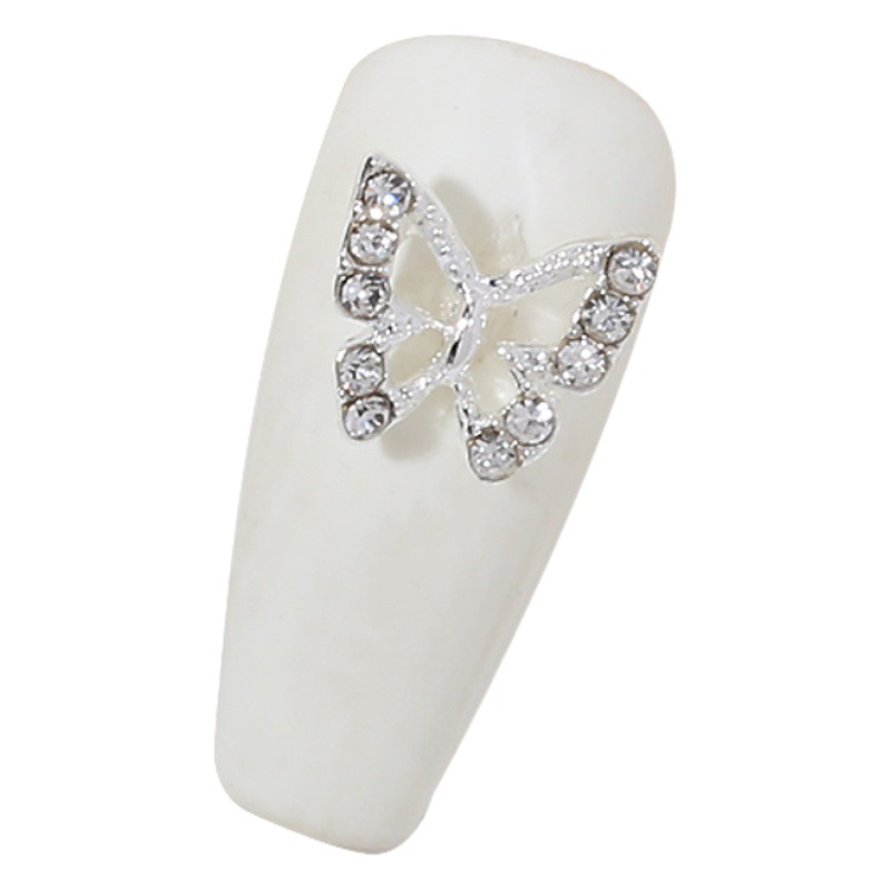 Venta caliente taladro de uñas arco de plata joyería tridimensional flash diamante esmalte de uñas decorativo diamante acabado pieza de uñas traje de joyería