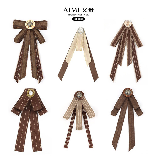 Lapel blouse with a British academic style, coffee brown color, featuring a vintage butterfly bow tie, collar flowers, and a pin accessory.