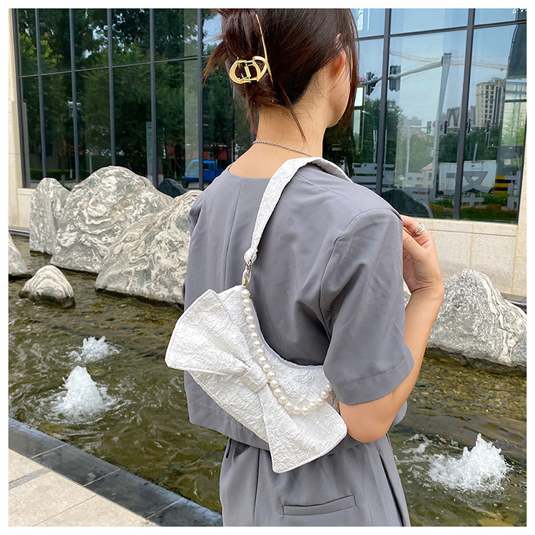 Bowknot Solid Color Pearl Chain Folds Single Shoulder Messenger Underarm Bag Wholesale Nihaojewelry display picture 2