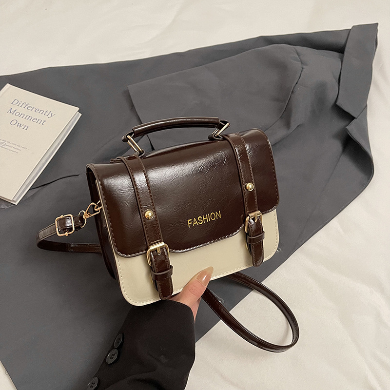 Bolso de mano retro británico para mujeres 2025, nueva moda, bolso cuadrado de color contrastante, bolso de mochila universal, primavera y verano, mujeres extranjeras