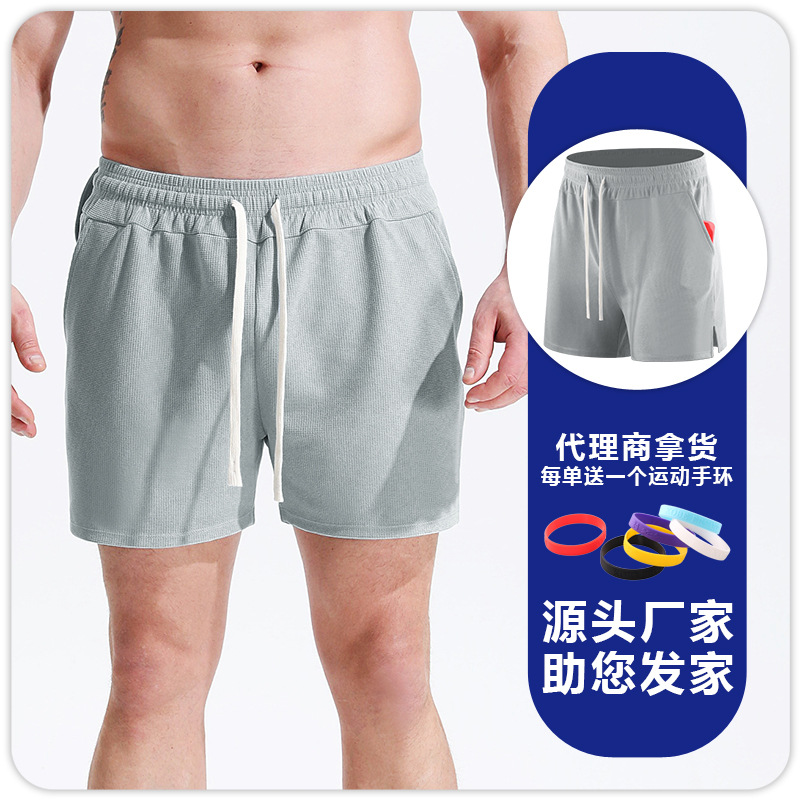Pantalones cortos deportivos de waffle para hombres correr fútbol fitness deportes de secado rápido transpirable cómodos pantalones sueltos de cuartos delgados