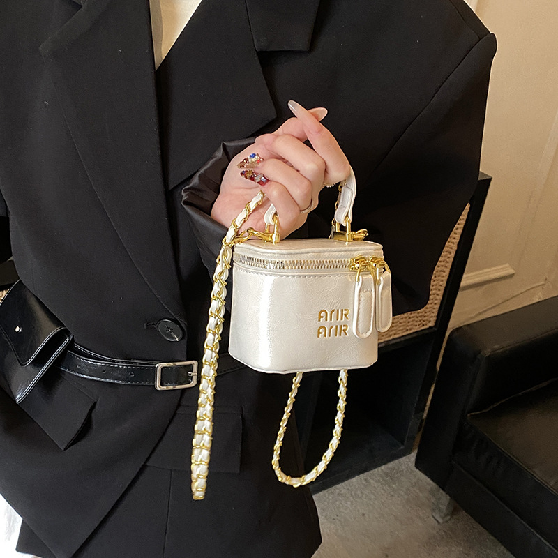Nuevos bolsos infantiles transfronterizos letras extranjeras mini bolsos de bebé cadena de piel de aceite bolsos de caja de color sólido para niñas