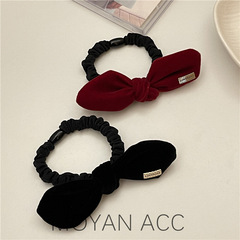 Korean-style sophisticated black velvet bow hair tie for women — chic elastic hairband perfect for tying up small ponytails, ideal for fall and winter.