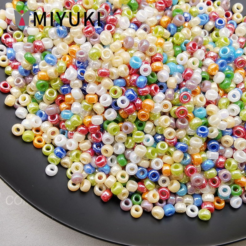 MIYUKI Yuki Japón importación de 2mm de alto brillo esmalte de vidrio de color arroz cuentas hechas a mano DIY material de collar de pulseras de cuentas