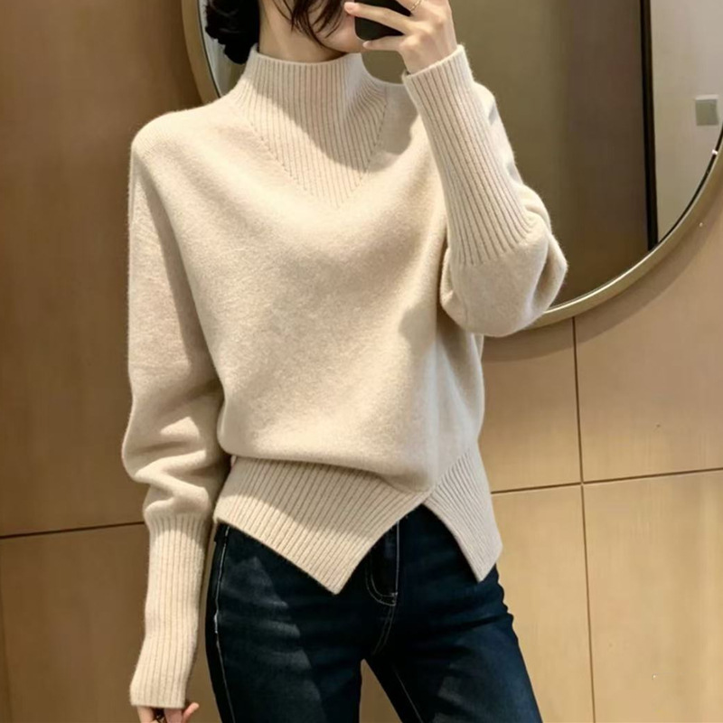 Korean-style elegant half-high collar pullover sweater for women with an asymmetrical cross hem design, loose and slimming knitwear Korean-style elegant half-high collar pullover sweater for women with an asymmetrical cross hem design, loose and slimming knitwear
