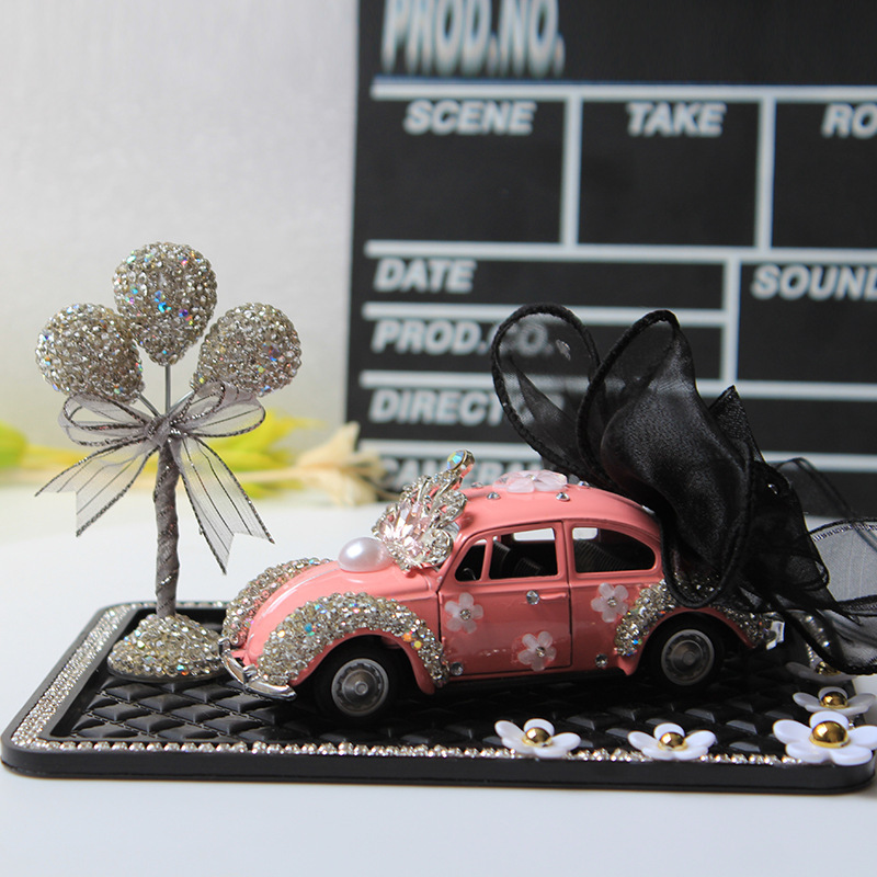 Modelo de coche, modelo de coche de arco creativo y colorido, adornos de diamantes, accesorios de interior de coche, decoración de tapete antideslizante de margarita pequeña