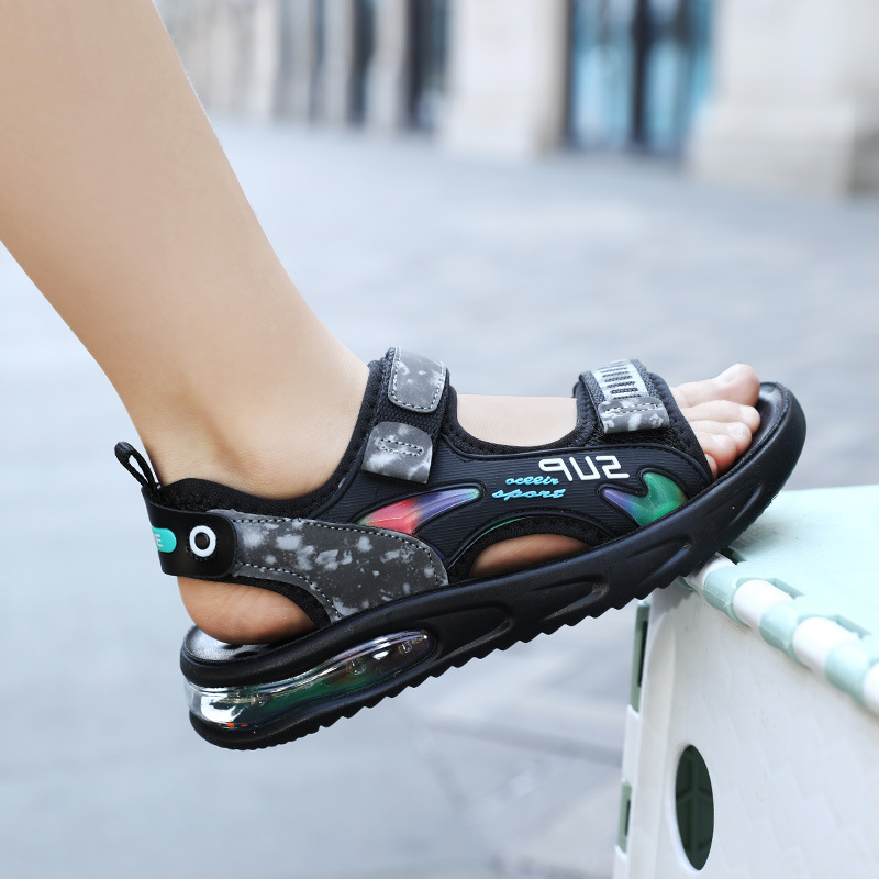 Infancia fresca de niños zapatos de playa de marea suave nuevos zapatos de playa para niños sandalias de aire para niños deportes medianos y grandes