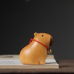 卸売りの南米の黄楊の木のカピバラの置物は解凍してデスクトップの装飾のかわいいカピバラの置物を癒します。