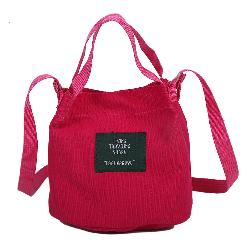 Bolso de mujer nuevo estilo coreano simple bolso de lienzo de chicas fresco de color sólido bolso de cubo de moda moda bolsa de mochila casual