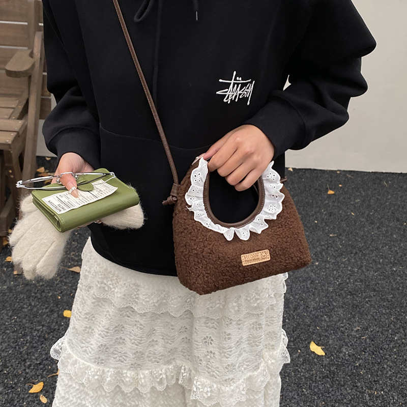 Bolsos para niños nuevos bolsos de encaje de color sólido extranjero nicho de diseño para padres e hijos cambio bolsos de mochila