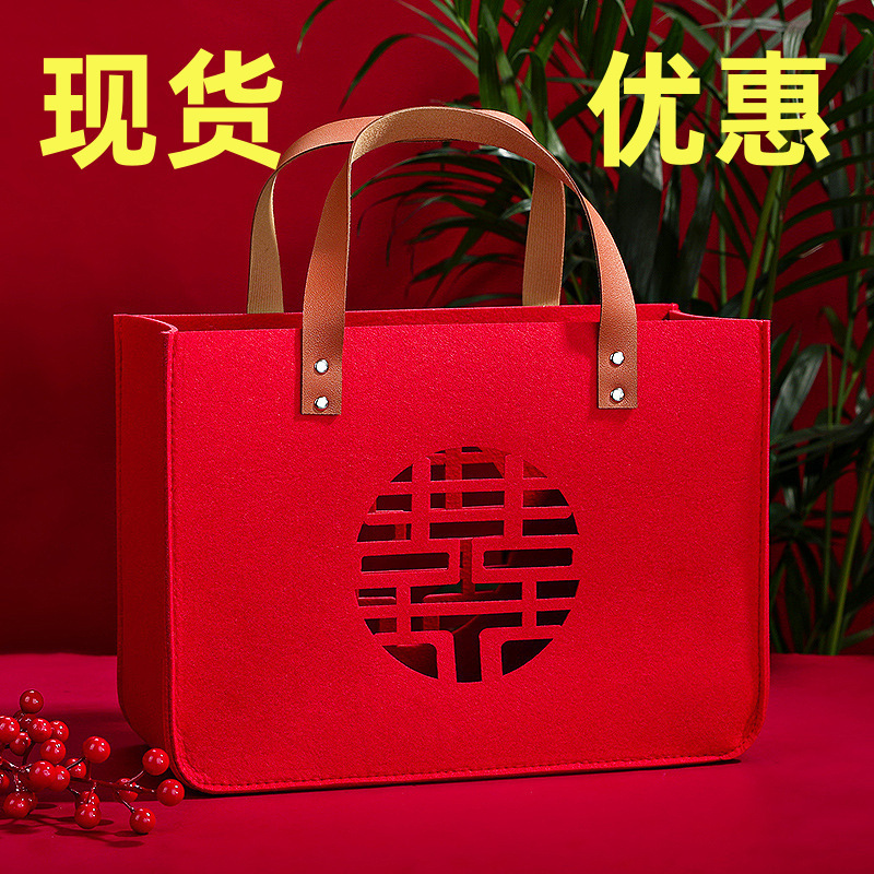 赤いフェルトは結婚の誕生日の贈り物の包みの満月の包みの寿の字の福の字の結婚祝いのお土産の袋の透かし彫りの手提げ袋を包みます。|undefined