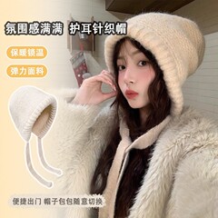 冬の韓国版は防寒耳の毛糸の帽子を合わせて、保温ニットの純色のリュックサックの帽子を厚くします。